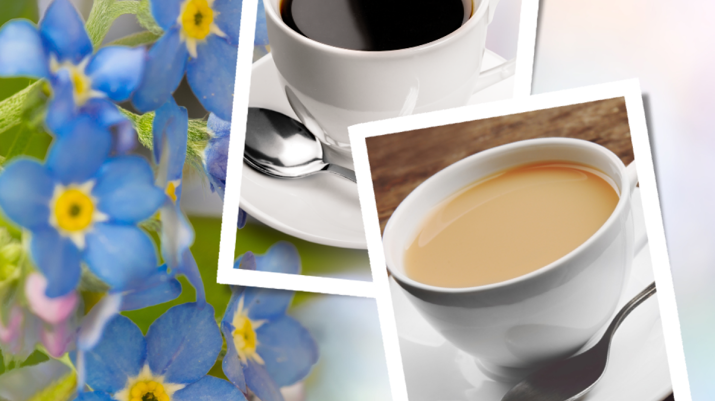 Forget-me-not flowers background with a cup of tea and a cup of coffee in the foreground