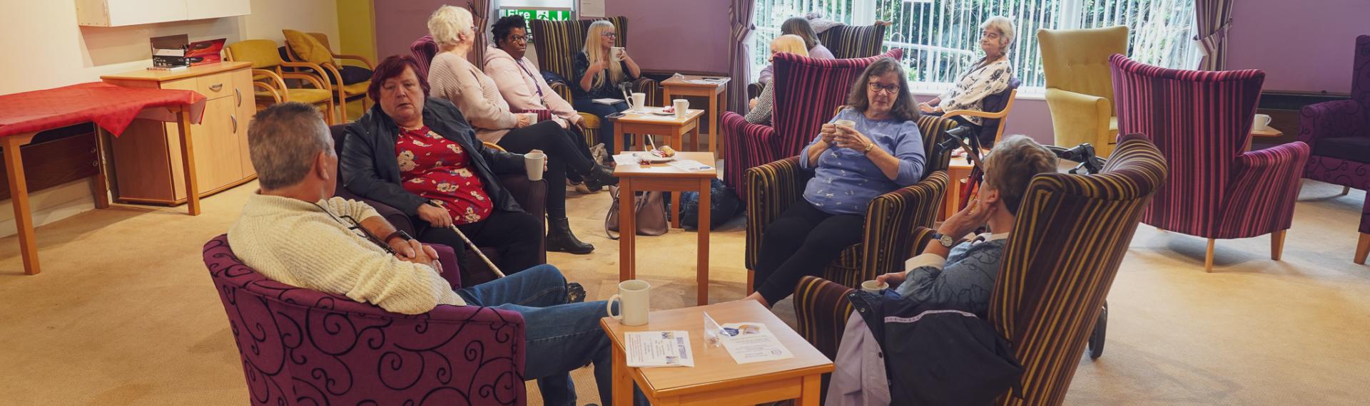 People sat in chairs arranged in a circle