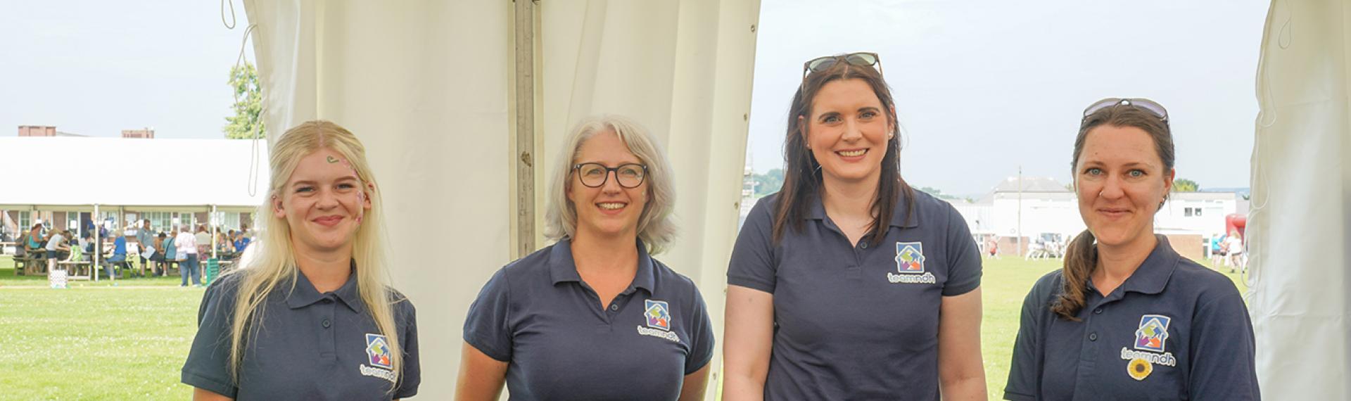Four female staff members at the Summer Fayre