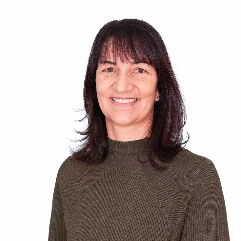 Philippa Butler; Finance Director; dark haired woman in brown jumper