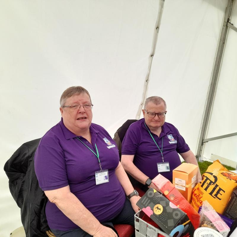 Two people sat on chairs 